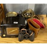 A kitchen scale and weights with a bakelite radio, binoculars and camera.