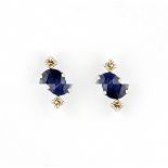 A pair of 900 platinum stud earrings set with oval cut sapphires and diamonds, L. 0.9cm.