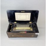 A 19th century six tune music box, in working order, 38 x 18 x 12cm.