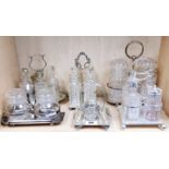 A group of six silver plate and glass cruet sets, tallest H. 25cm.
