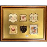 Football interest: A frame of six early 20th century football cap badges, awarded to JJ Radnage