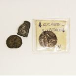 An Elizabeth I stamped silver sixpence with two further early bronze coins.