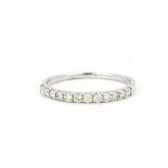 A 9ct white gold half eternity ring set with brilliant cut diamonds, approx. 0.33ct total, (Q.5).