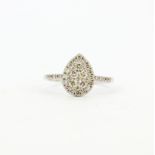 An 18ct white gold pear shaped ring set with brilliant cut diamonds and diamond set shoulders,