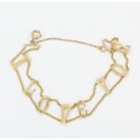 A hallmarked 9ct yellow gold bracelet with the words 'I love you', L. 10.5cm.