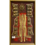 A framed set of military buttons and insignia, 25 x 50cm.