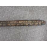 An interesting wood and metal extendable surveyor's measuring stick, unextended L. 159cm.