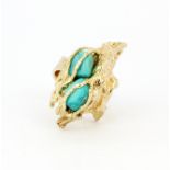 A heavy hallmarked 9ct yellow gold large ring set with turquoise, (L).