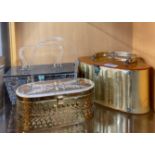 A group of three 1950's lucite and metal handbags, widest W. 26cm, (unfortunately, badly stored,