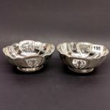 A pair of pierced silver dishes, W. 13.5cm, stamped silver and tested.