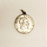 An 1876 silver Victor Emmanuel coin mounted as a pendant.