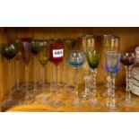 A collection of good coloured stem glasses by Artland and others.