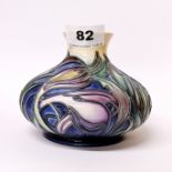 A 2003 Moorcroft Tube lined bud vase 'Saffron Crocus' pattern, no. 133/150 and signed by the artist,