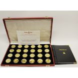 A cased Pobjoy Mint set of twenty four gold clad sterling silver coins, limited edition 0085/3000,