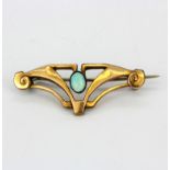 A handmade Jugendstil gold fronted brooch set with a cabochon cut opal, L. 3.6cm.