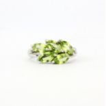 A matching 925 silver ring set with marquise cut peridots, (O).