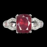 A 925 silver ring set with a cushion cut ruby and white stone set shoulders, (P).