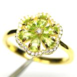A gold on 925 silver cluster ring set wiith peridot and white stones, (N.5).