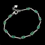 A 925 silver bracelet set with oval cut emeralds and white stones, L. 18cm.