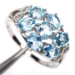 A 925 silver ring set with oval cut blue topaz, (O).