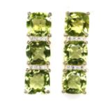 A pair of gold on 925 silver peridot set earrings, L. 2cm.