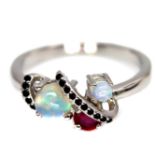 A 925 silver ring set with cabochon cut opals, rubies and black spinels, (N.5).