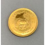 A fine 1982 gold 1oz krugerrand coin.
