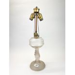 A 19th C frosted glass oil lamp mounted as an electric lamp, H. 56cm.