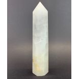 A large rock crystal point, H. 25cm.