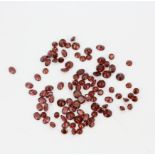 A quantity of unmounted natural round and oval cut garnets, approx. 94.17ct total.