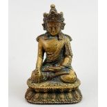A Tibetan bronze figure of the seated Buddha, H. 14cm.