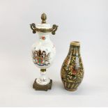 An Ormulu mounted French porcelain urn with fixed cover, together with a hand painted pottery