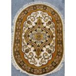 An oval Eastern style rug, 210 x 150cm.
