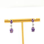 A pair of 925 silver drop earrings set with oval cut amethysts and cubic zirconias, L. 2.3cm.