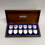A cased set of The Royal Arms silver ingots by Danbury Mint, issued c. 1976, each ingot weighing