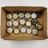 A group of sixteen vintage pocket watches.