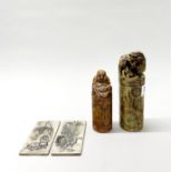 Two Chinese carved soapstone seals tallest H. 15cm, and two white metal ingots.