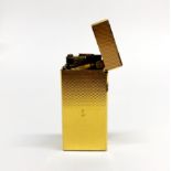 A boxed Dunhill gold plated lighter.