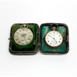 A white metal cased silvered dial pocket watch in a hallmarked silver pocket watch case together