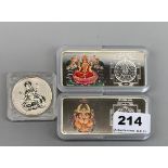 Two Indian enamelled 100g fine Swiss silver ingots, together with a fine silver Hindu coin.