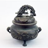 A Chinese bronze censer with dragon handle, H. 18cm W. 18cm.