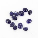 A quantity of unmounted natural oval cabochon iolite, approx. 24.09ct total.