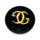 A vintage Gucci leather and gilt metal desk paperweight, Dia. 13cm.