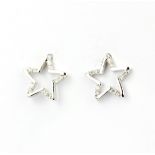 A pair of 18ct white gold star shaped stud earrings set with diamonds, L. 7mm.