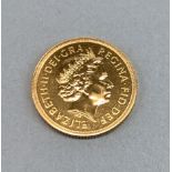 A 2002 gold sovereign.