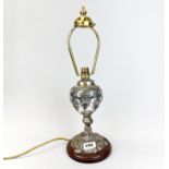 A 19th C silver plated oil lamp base mounted as a table lamp, H. 46cm.
