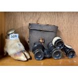 An antique hoof inkwell, with a pair of field glasses and a pair of opera glasses.