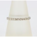 A 9ct white gold half eternity ring set with brilliant cut diamonds, approx. 0.33ct total, (Q.5).