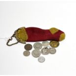 An unusual early 20th C woven sock coin purse and contents, L. 12cm.