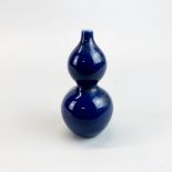 A small Chinese cobalt blue glazed porcelain gourd vase, H. 11cm.